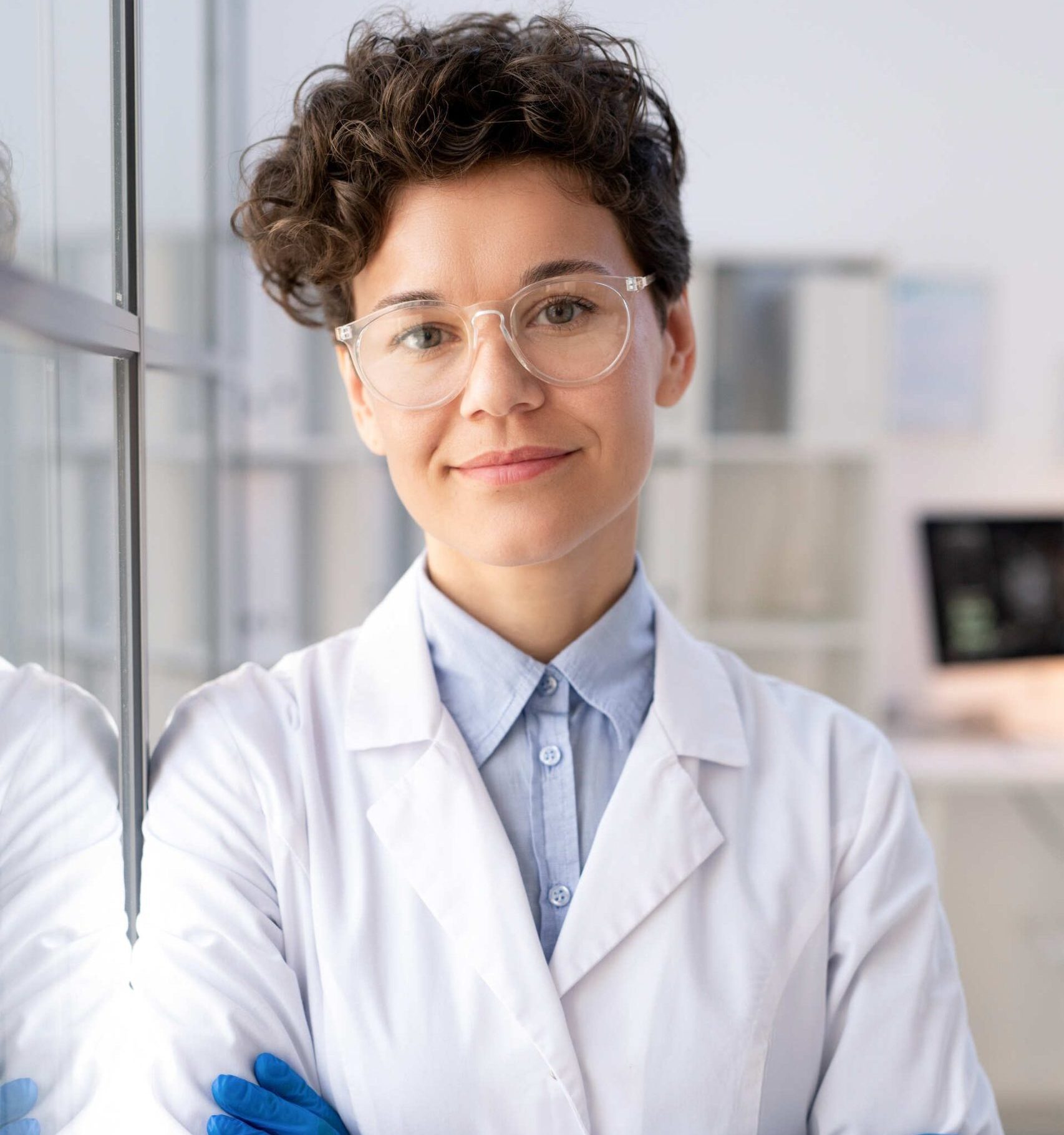 Female scientist in lab coat.